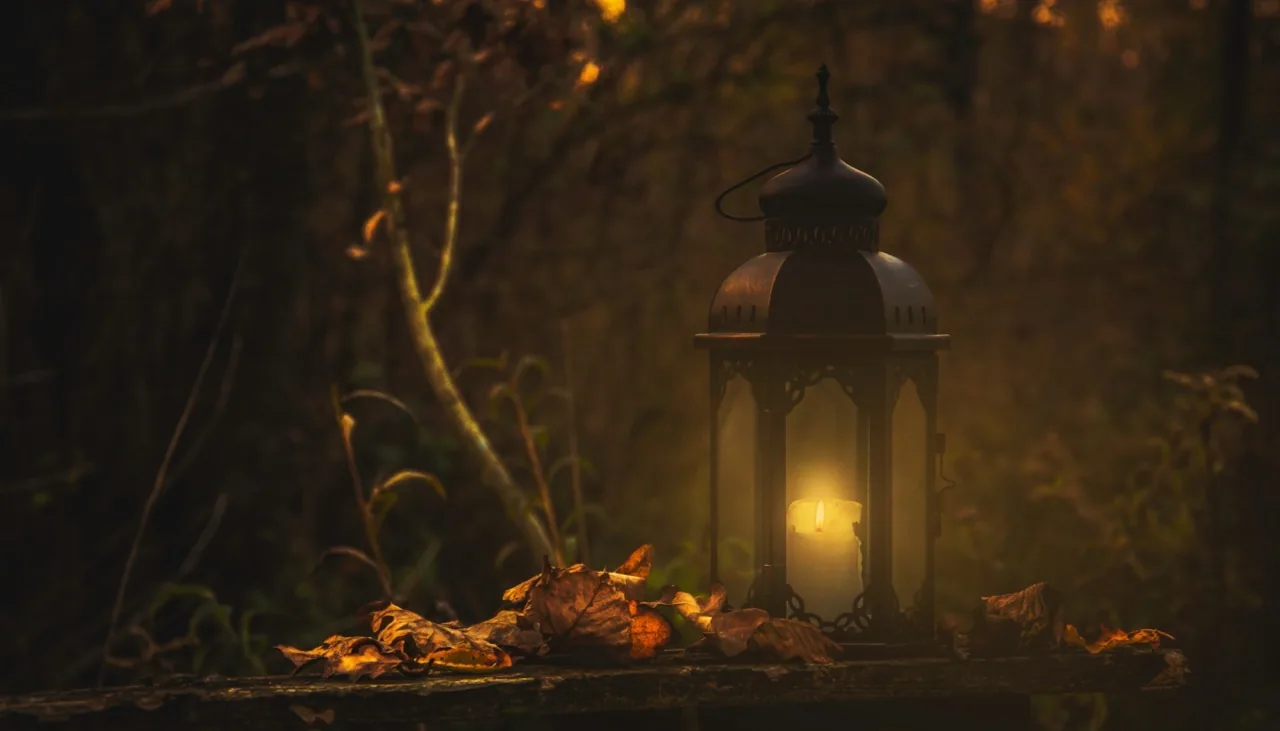 A lantern glowing in the evening light.